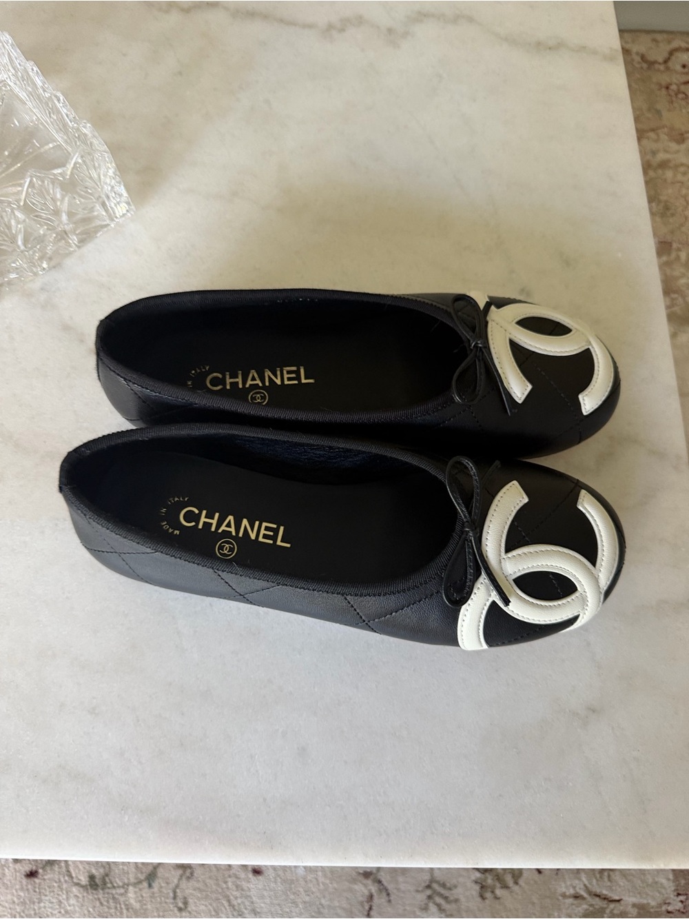 CHANEL Black Leather Ballet Flats with White CC Toe Cap